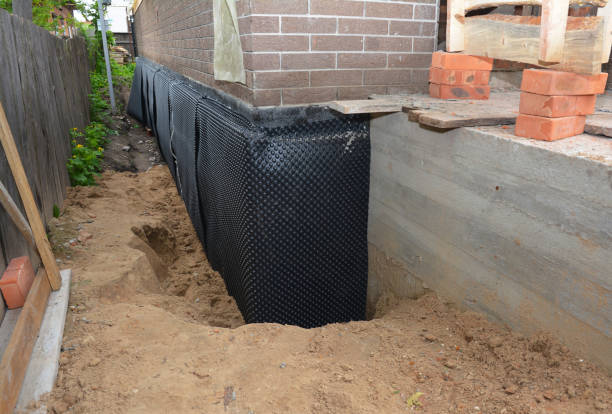 SJ Waterproofing Pros technician performing targeted Waterproofing assessment in Harrisburg, NC